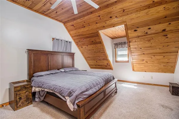a bed sitting in a room next to a window