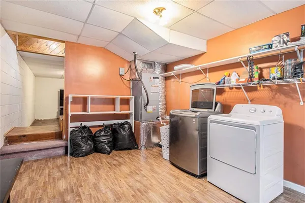 a view of a storage & utility room with washer and dryer