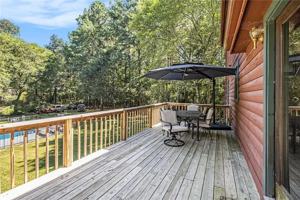 a view of balcony with furniture and wooden floor