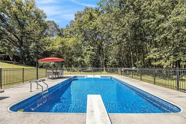 a view of a swimming pool with a lounge chairs