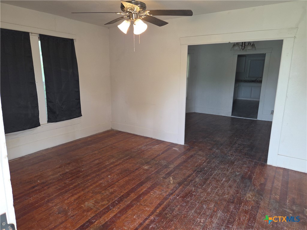 1219 South 10th Street Temple, TX 76504 - Photo 2 of 7 wooden floor in an empty room
