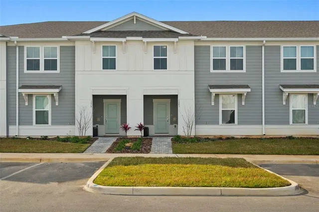 front view of a house with a yard