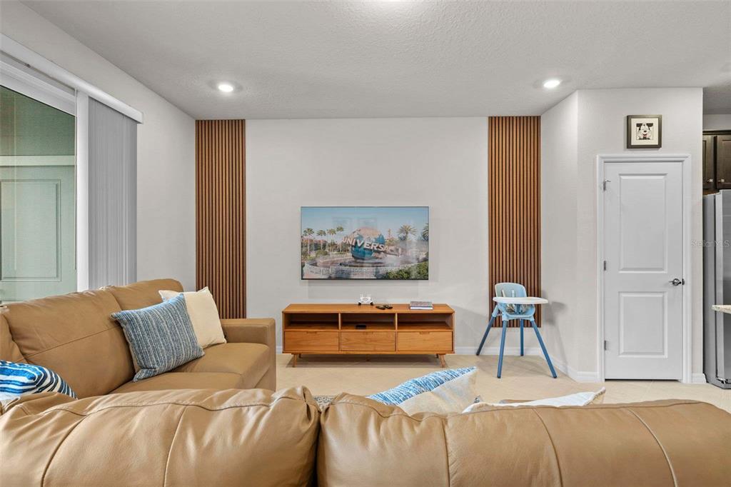 1283 Blue Paradise Way Clermont, FL 34714 - Photo 8 of 55 a bedroom with a bed and a couch