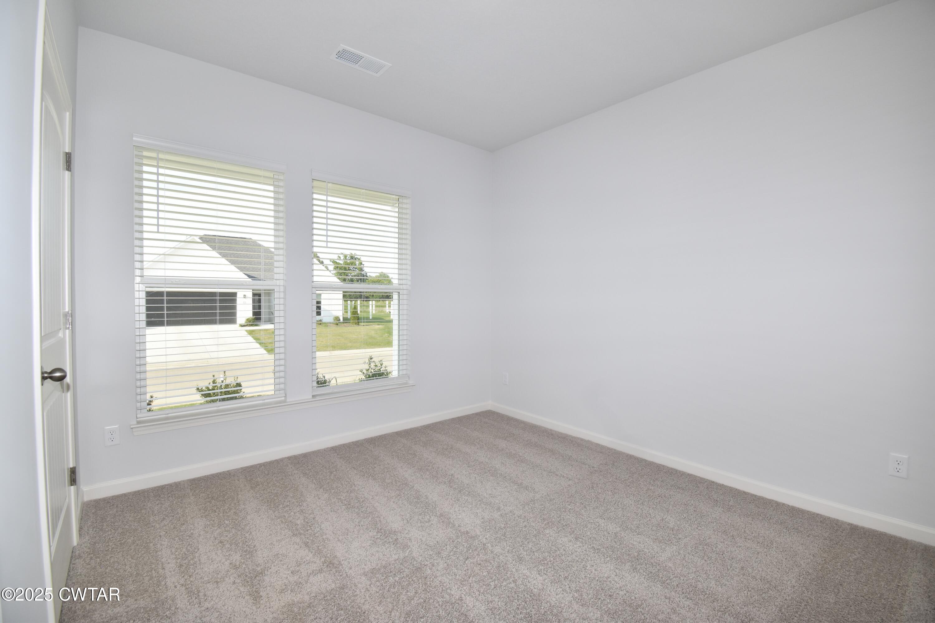 75 Clarendon Cove Jackson, TN 38305 - Photo 16 of 21 a view of an empty room with a window