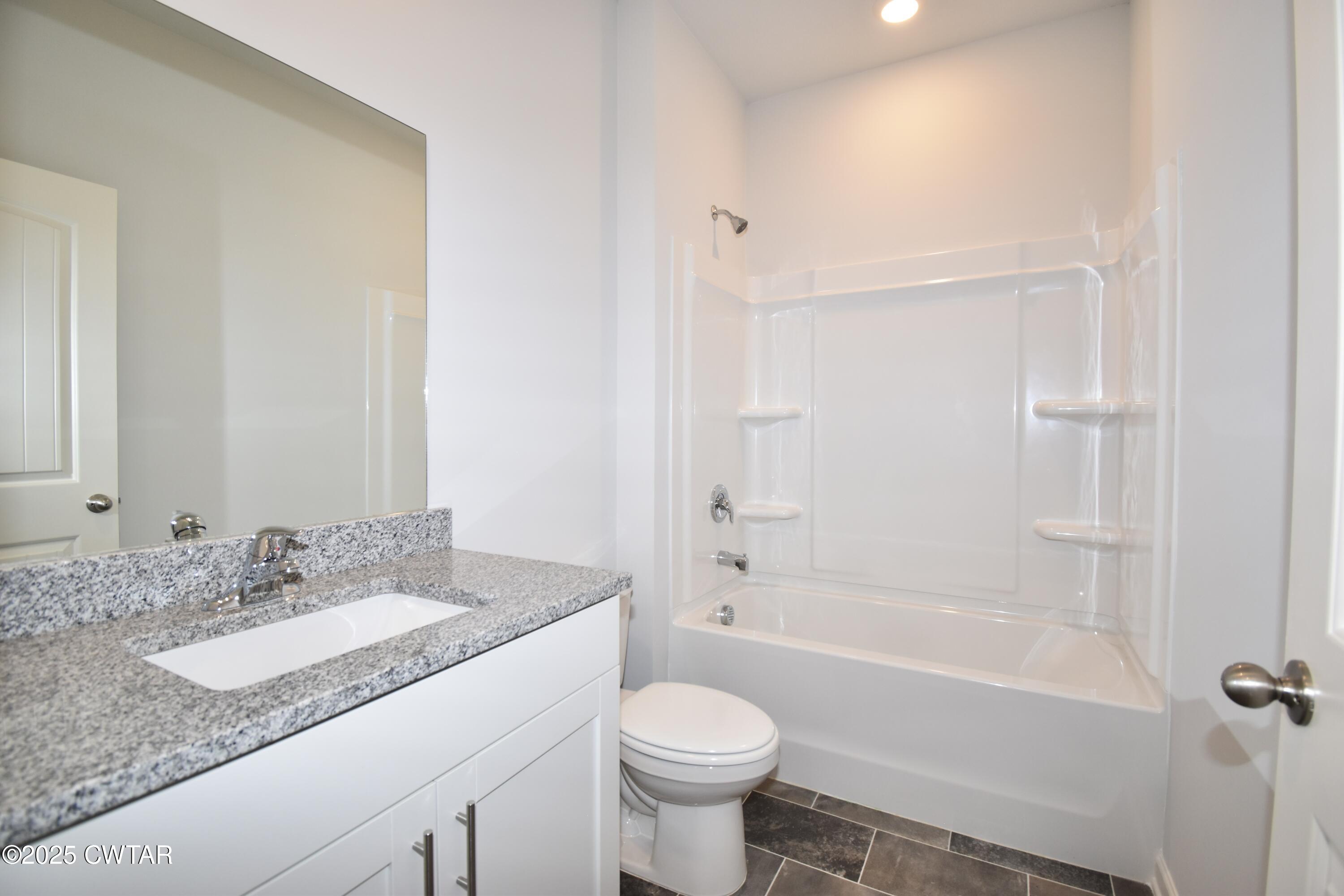 75 Clarendon Cove Jackson, TN 38305 - Photo 17 of 21 a bathroom with a granite countertop sink toilet and shower