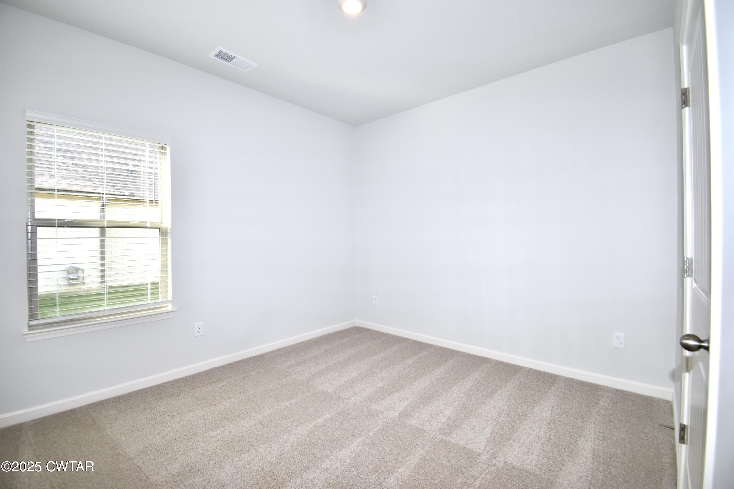 75 Clarendon Cove Jackson, TN 38305 - Photo 18 of 21 an empty room with a window