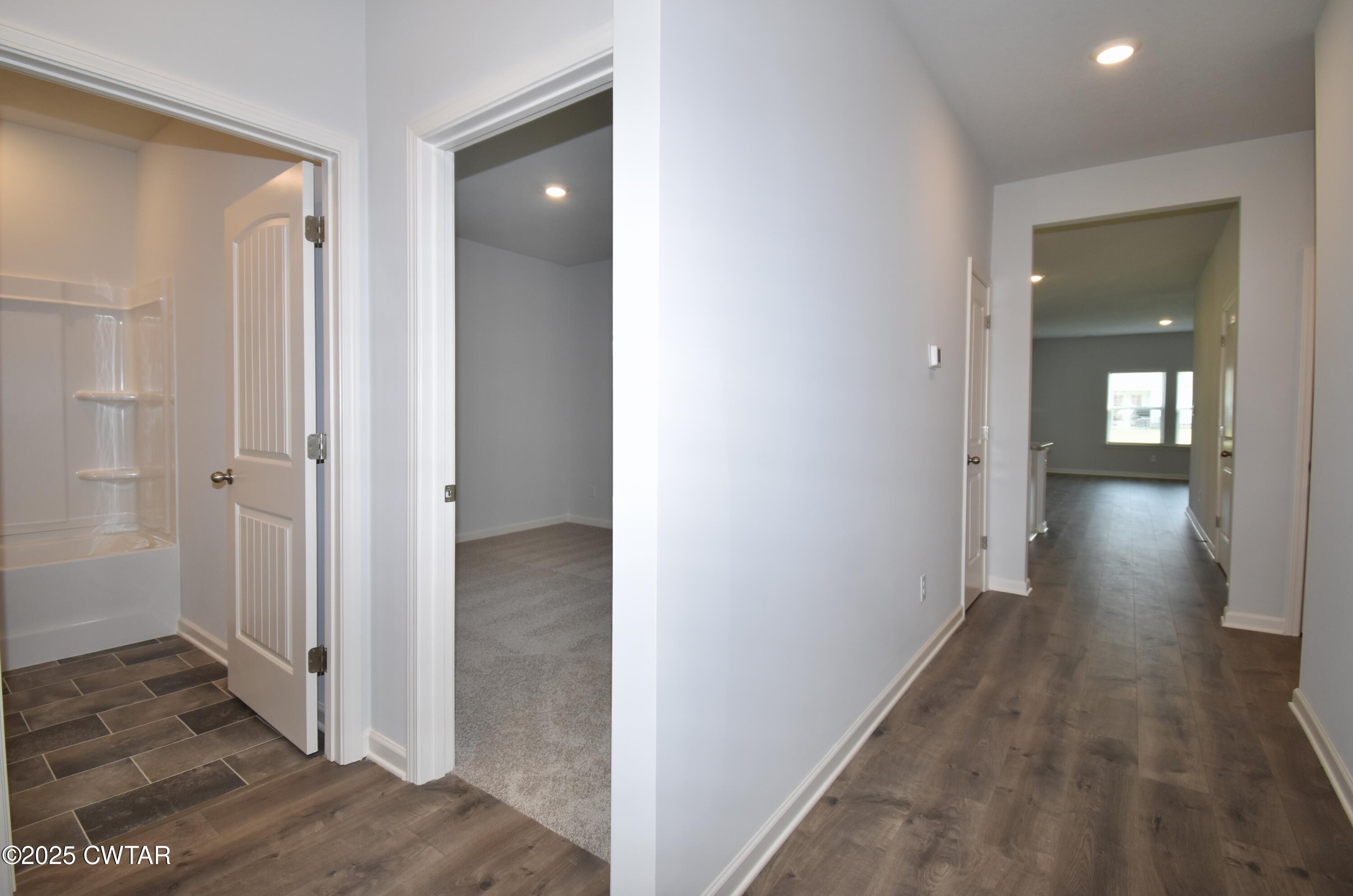 75 Clarendon Cove Jackson, TN 38305 - Photo 19 of 21 a view of a hallway with wooden floor and closet