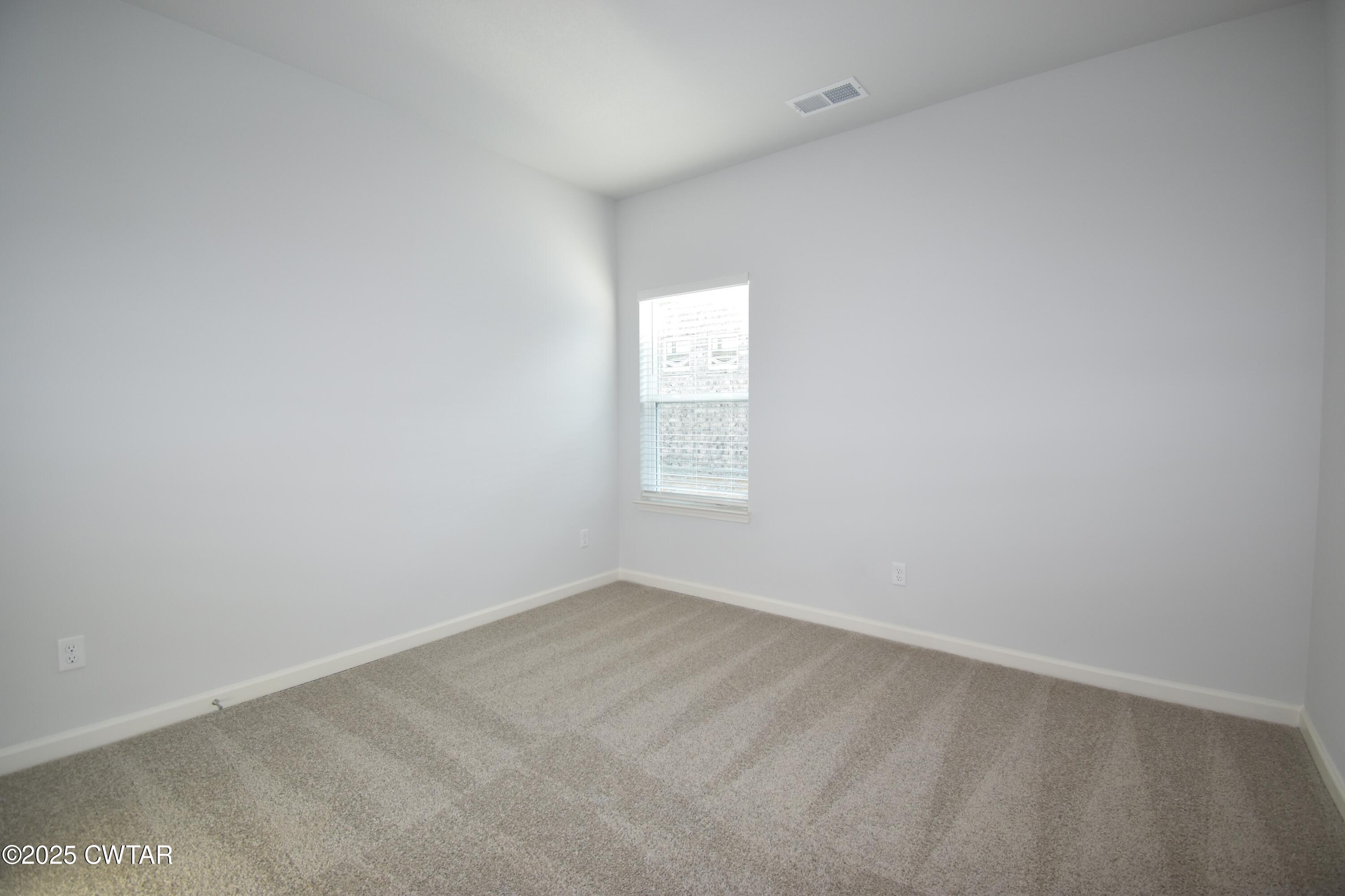 75 Clarendon Cove Jackson, TN 38305 - Photo 20 of 21 an empty room with a window