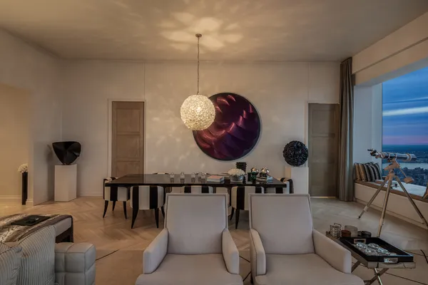 a bathroom with a table and a mirror
