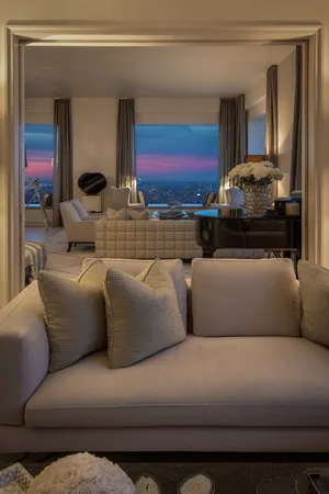 a view of a terrace with couches and sky view
