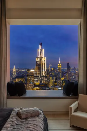 a bedroom with a bed and a couch