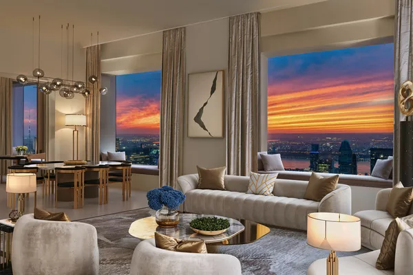 a living room with furniture a flat screen tv and a floor to ceiling window