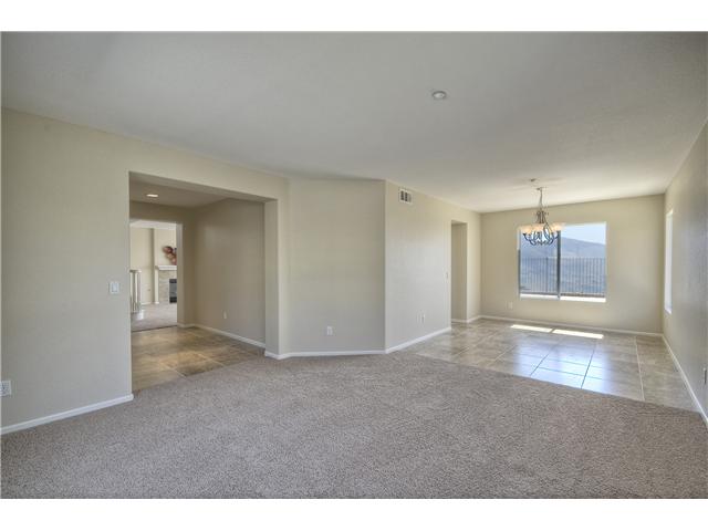 Shows Living room, dining area on right and part of entry on the left.