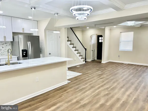 a view of a living room and kitchen