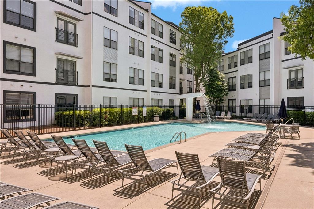 821 Ralph McGill Boulevard Northeast, Unit 2113 Atlanta, GA 30306 - Photo 11 of 29 a view of a patio with a table and chairs and potted plants