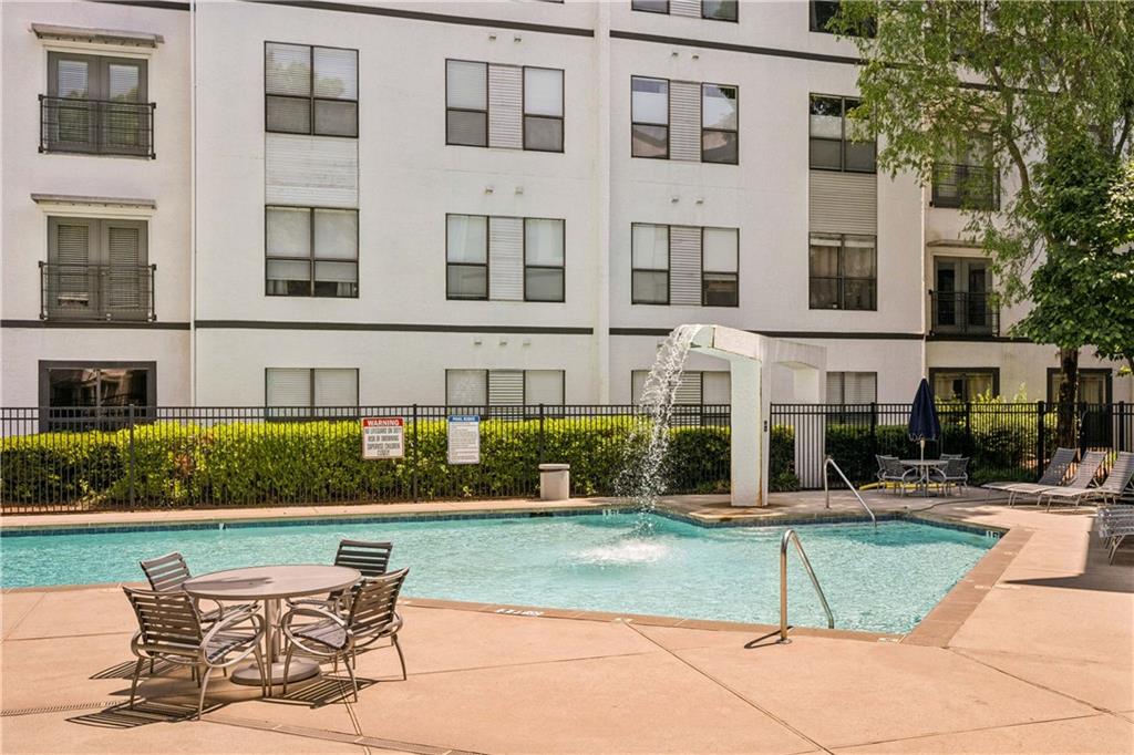 821 Ralph McGill Boulevard Northeast, Unit 2113 Atlanta, GA 30306 - Photo 13 of 29 a view of a building with a yard