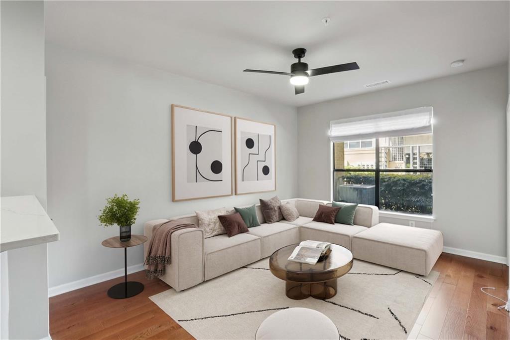 821 Ralph McGill Boulevard Northeast, Unit 2113 Atlanta, GA 30306 - Photo 2 of 29 a living room with furniture and a large window