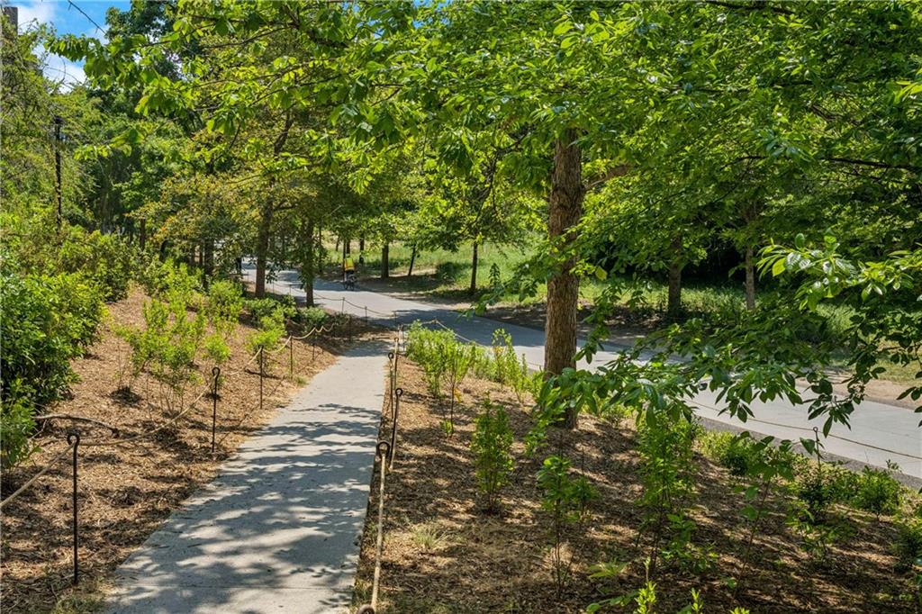 821 Ralph McGill Boulevard Northeast, Unit 2113 Atlanta, GA 30306 - Photo 28 of 29 a view of a lake view with houses in back