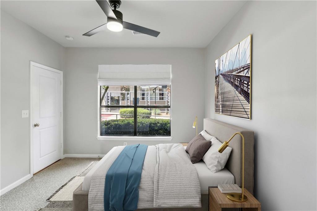 821 Ralph McGill Boulevard Northeast, Unit 2113 Atlanta, GA 30306 - Photo 5 of 29 a bedroom with a large bed and a window