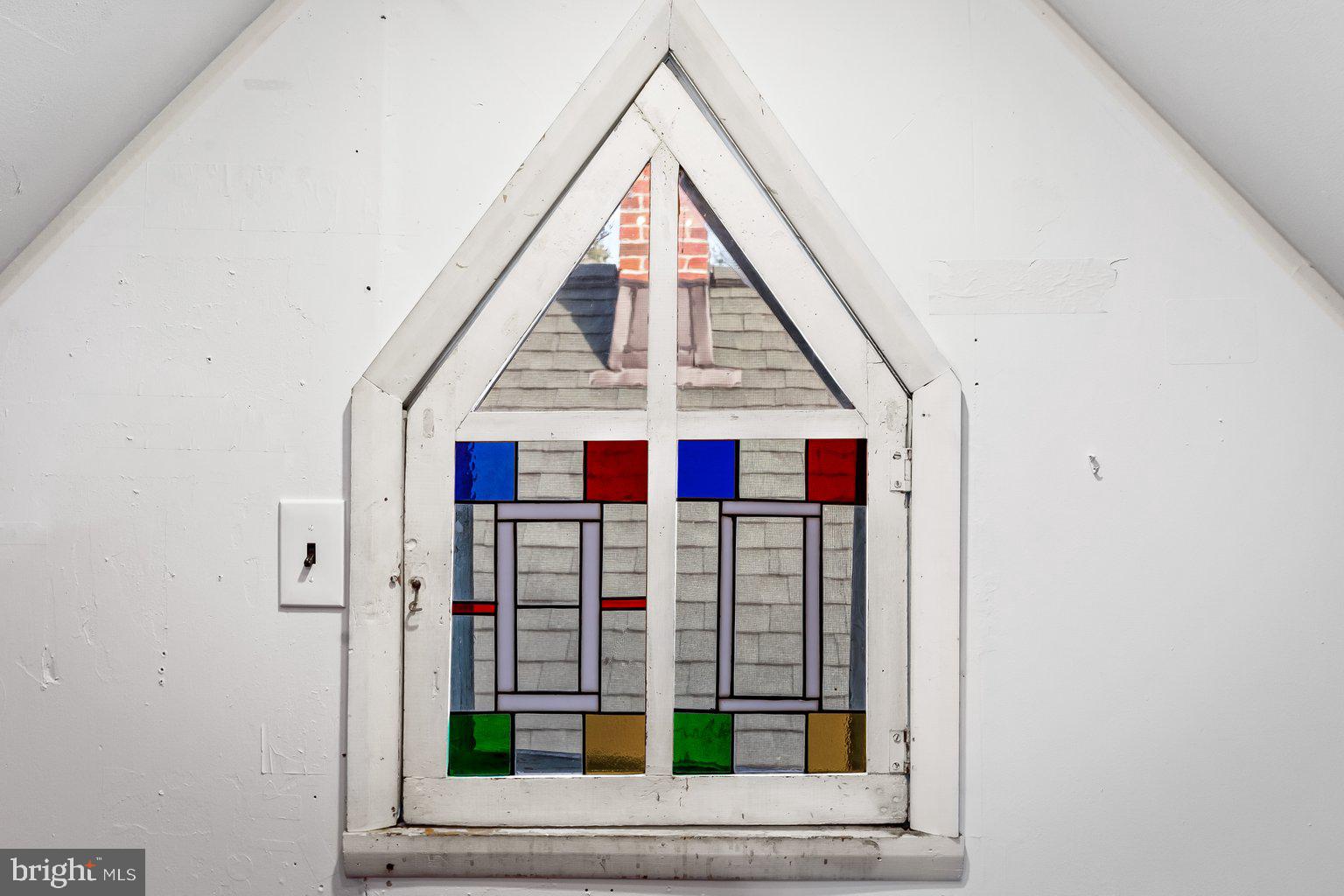 221 Alpine Road Baltimore, MD 21210 - Photo 39 of 54 Cool stained glass window in attic