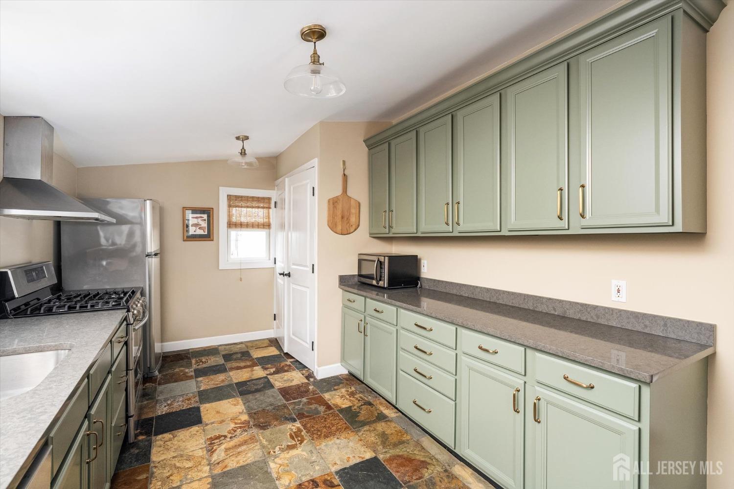 442 Ellisdale Road Chesterfield, NJ 08515 - Photo 14 of 42 a kitchen with granite countertop a sink stove and cabinets