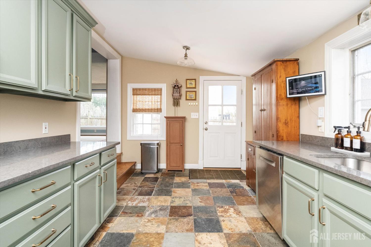 442 Ellisdale Road Chesterfield, NJ 08515 - Photo 17 of 42 a kitchen with a sink window and cabinets