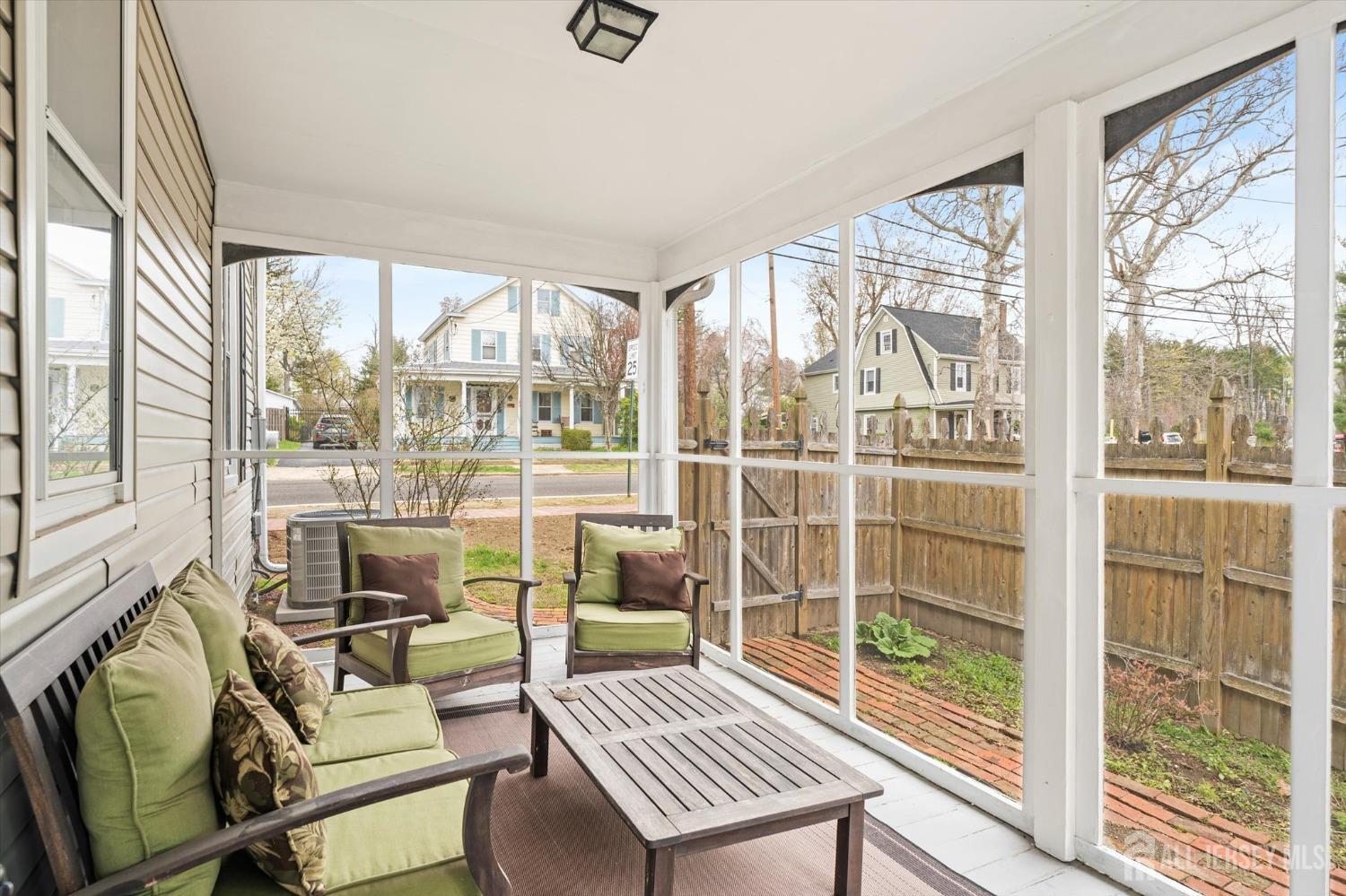 442 Ellisdale Road Chesterfield, NJ 08515 - Photo 18 of 42 a living room with furniture and floor to ceiling windows