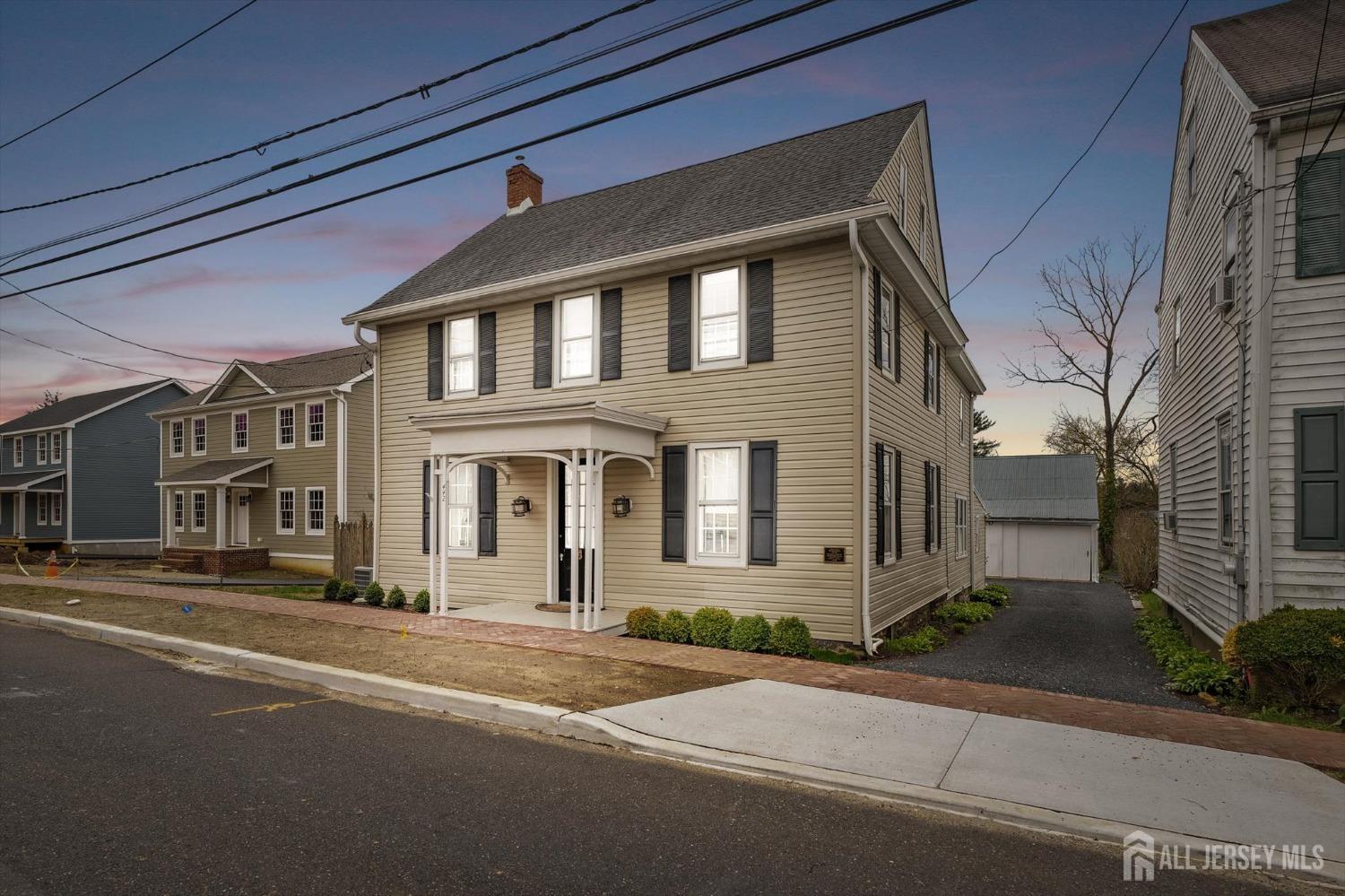 442 Ellisdale Road Chesterfield, NJ 08515 - Photo 2 of 42 a front view of a building with a road