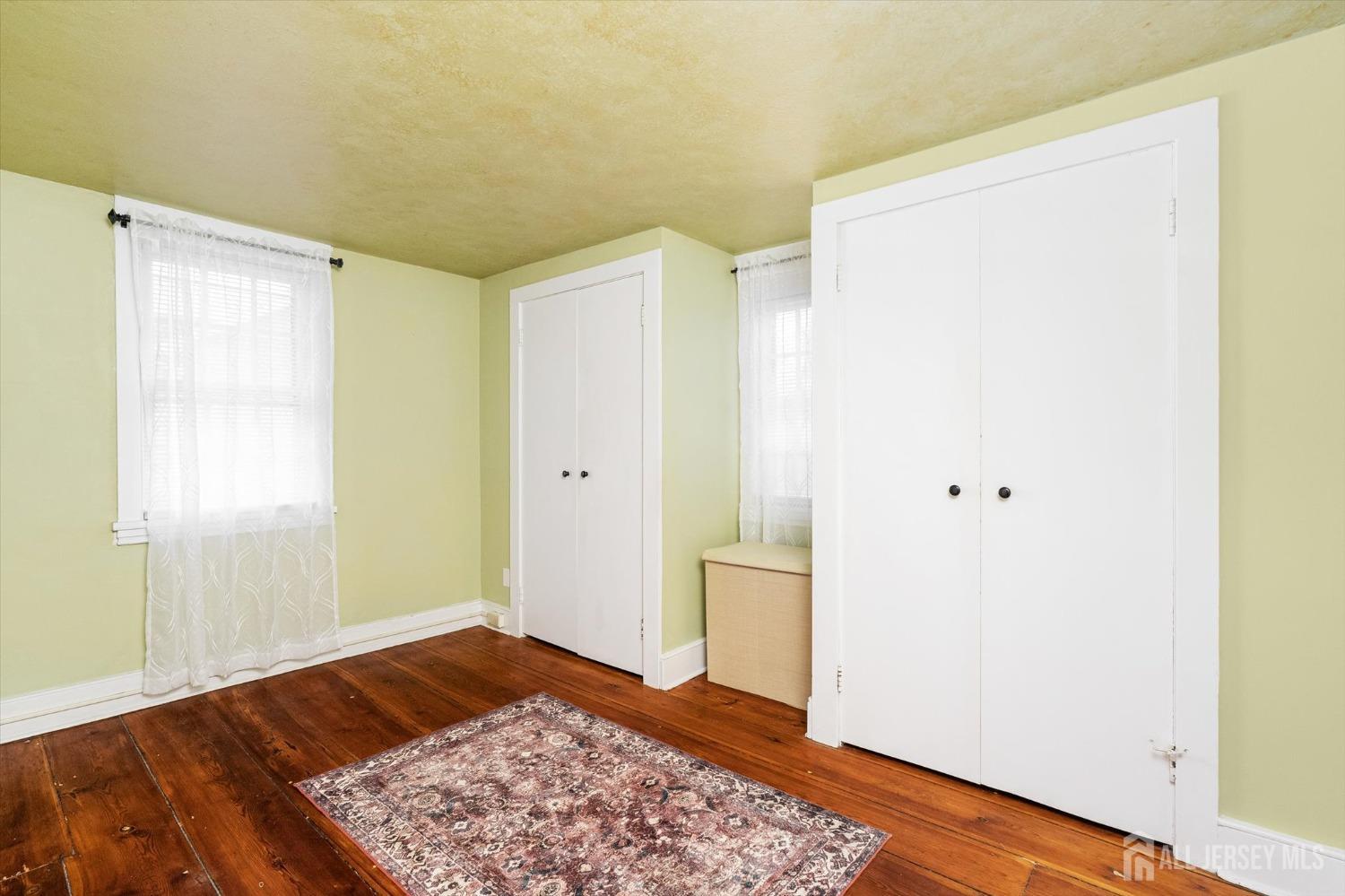 442 Ellisdale Road Chesterfield, NJ 08515 - Photo 21 of 42 a view of room with window and wooden floor