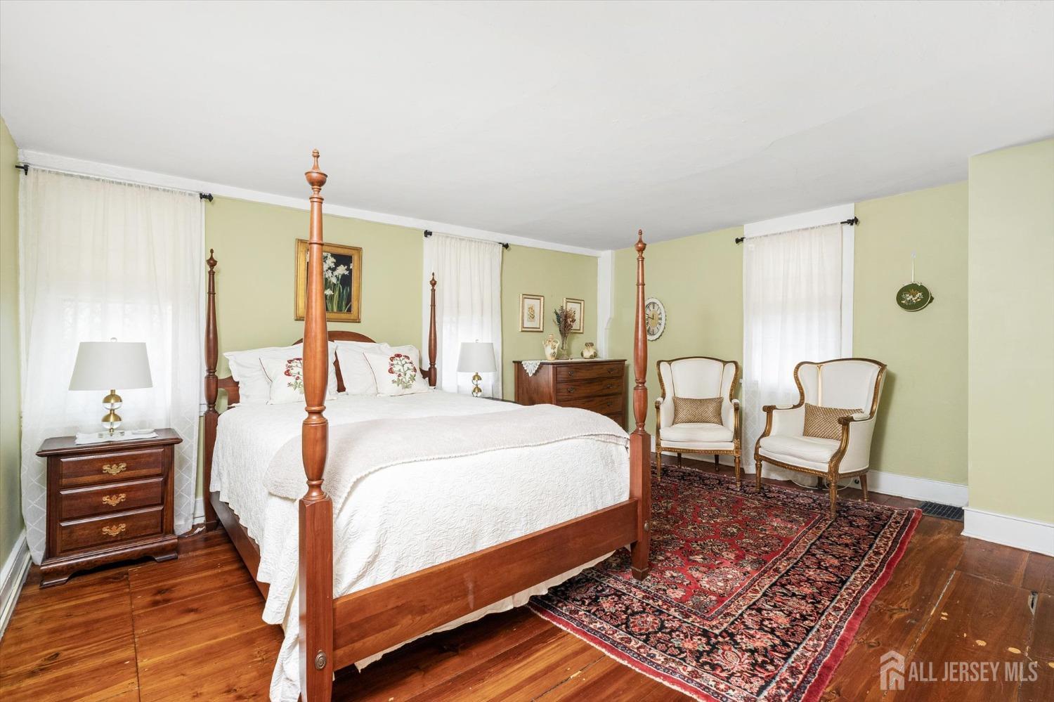 442 Ellisdale Road Chesterfield, NJ 08515 - Photo 22 of 42 a bedroom with a bed a chair and dresser