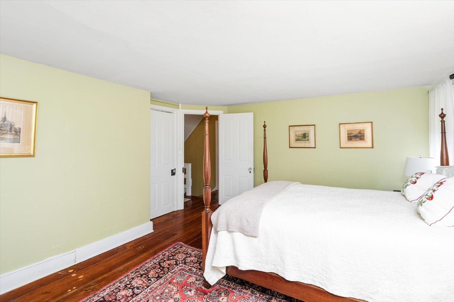 442 Ellisdale Road Chesterfield, NJ 08515 - Photo 23 of 42 a bedroom with a bed and wooden floor