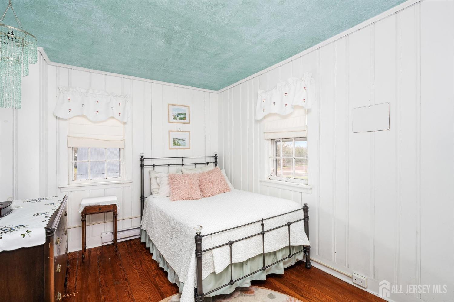 442 Ellisdale Road Chesterfield, NJ 08515 - Photo 27 of 42 a bedroom with a bed and a table in it