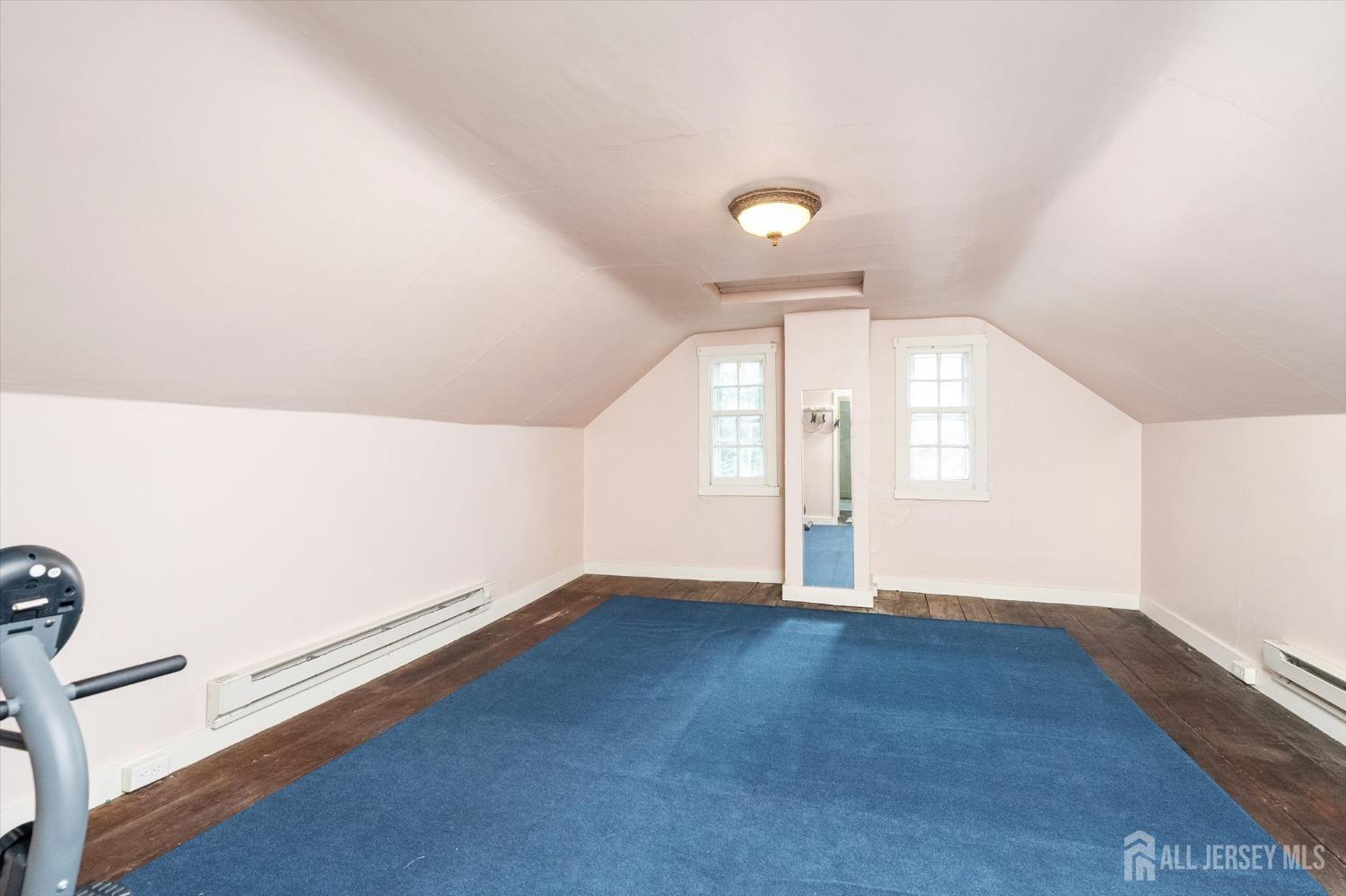 442 Ellisdale Road Chesterfield, NJ 08515 - Photo 30 of 42 an empty room with wooden floor and windows