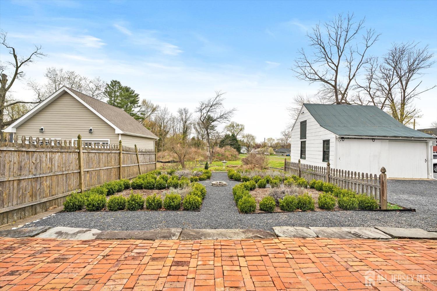 442 Ellisdale Road Chesterfield, NJ 08515 - Photo 32 of 42 a view of a house with a yard and plants