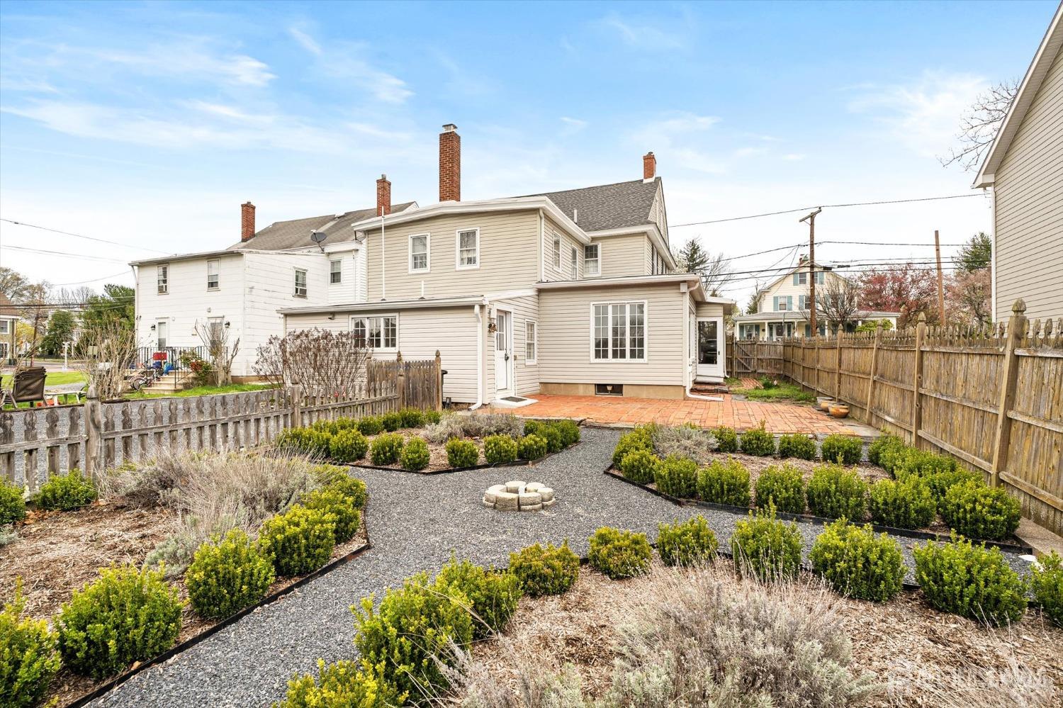 442 Ellisdale Road Chesterfield, NJ 08515 - Photo 36 of 42 a front view of a house with a garden