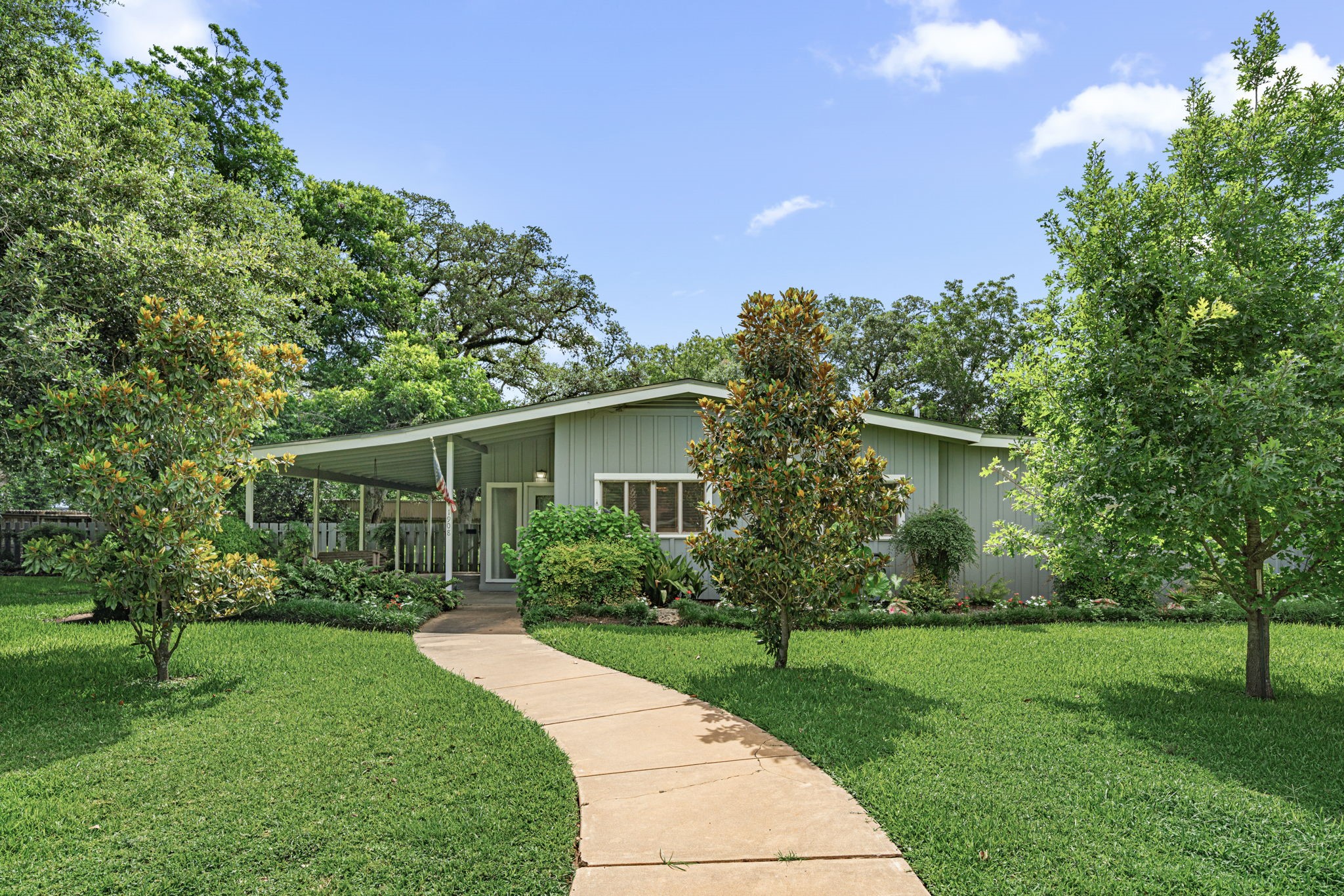 front view of a house with a yard