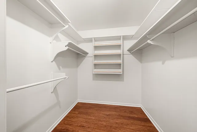 a bathroom with a sink vanity and mirror