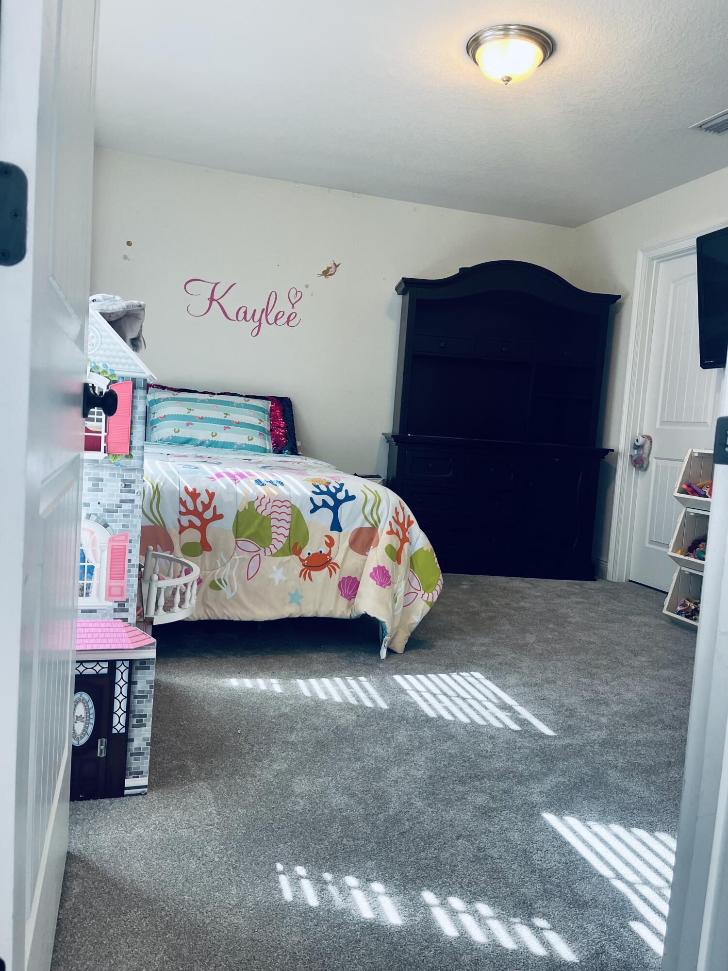 233 Maddox Street Santa Rosa Beach, FL 32459 - Photo 11 of 14 a bedroom with a bed and a window