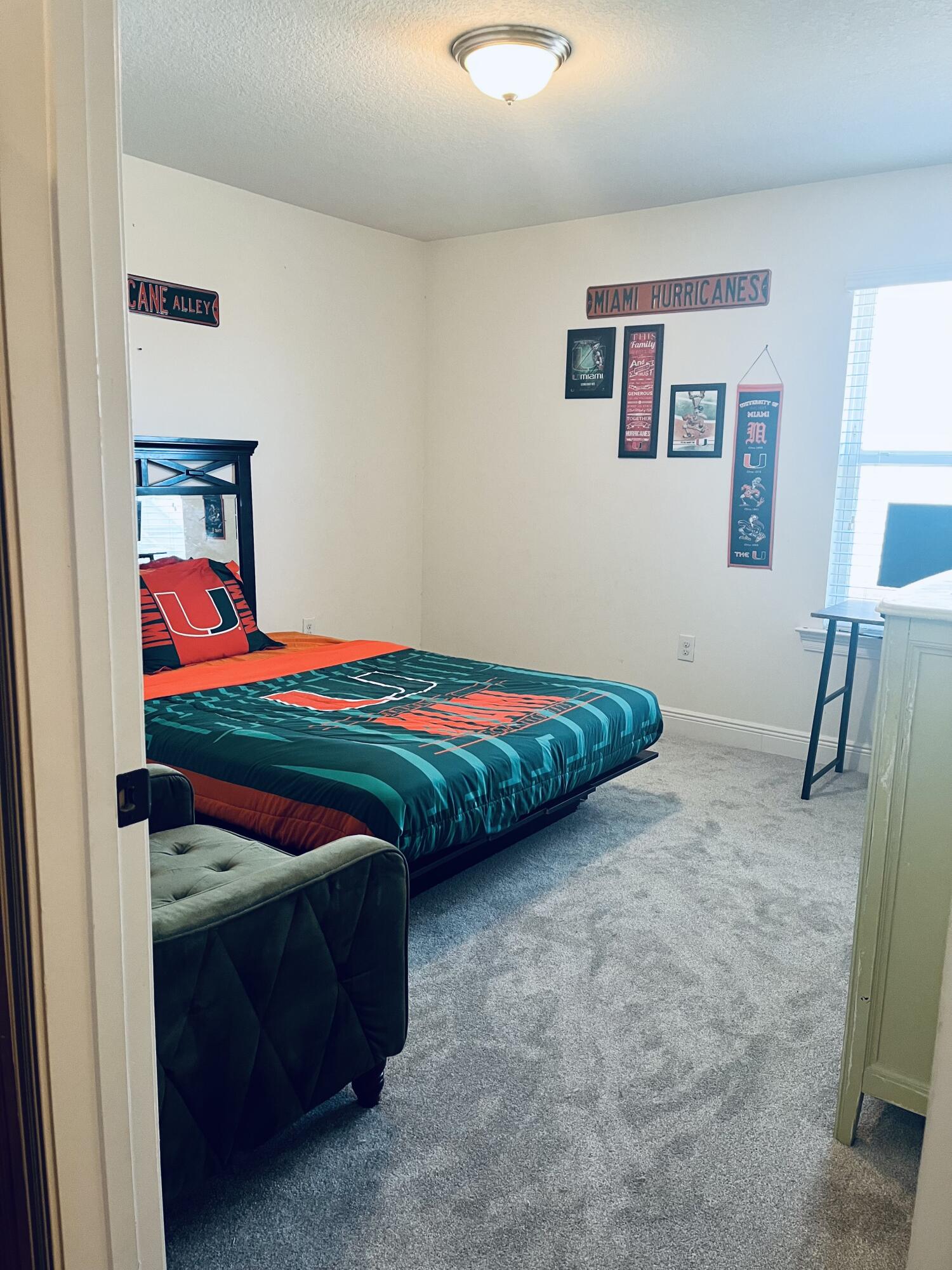233 Maddox Street Santa Rosa Beach, FL 32459 - Photo 12 of 14 a room with a bed and a chair
