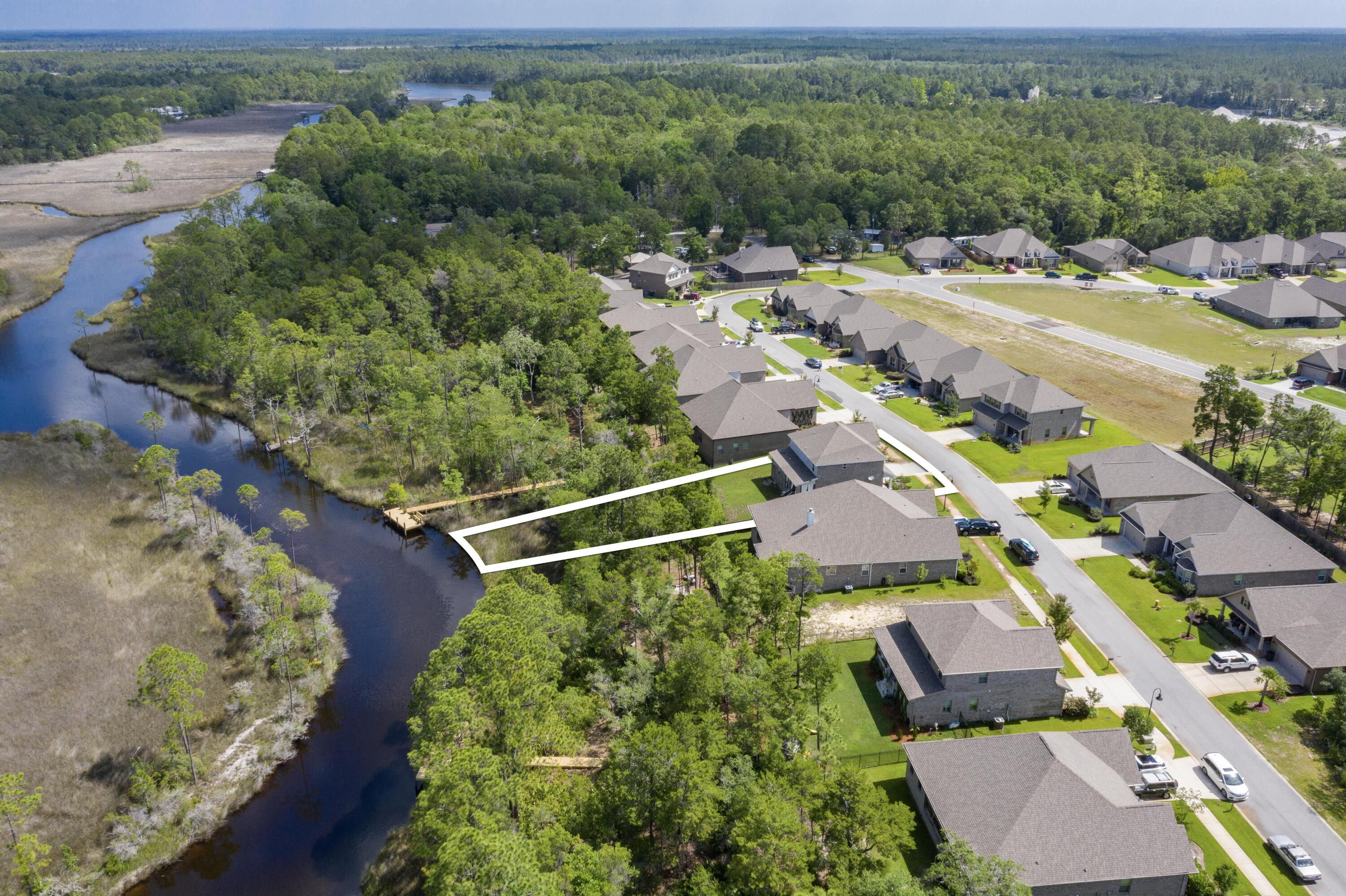 233 Maddox Street Santa Rosa Beach, FL 32459 - Photo 5 of 14 an aerial view of a house with a garden