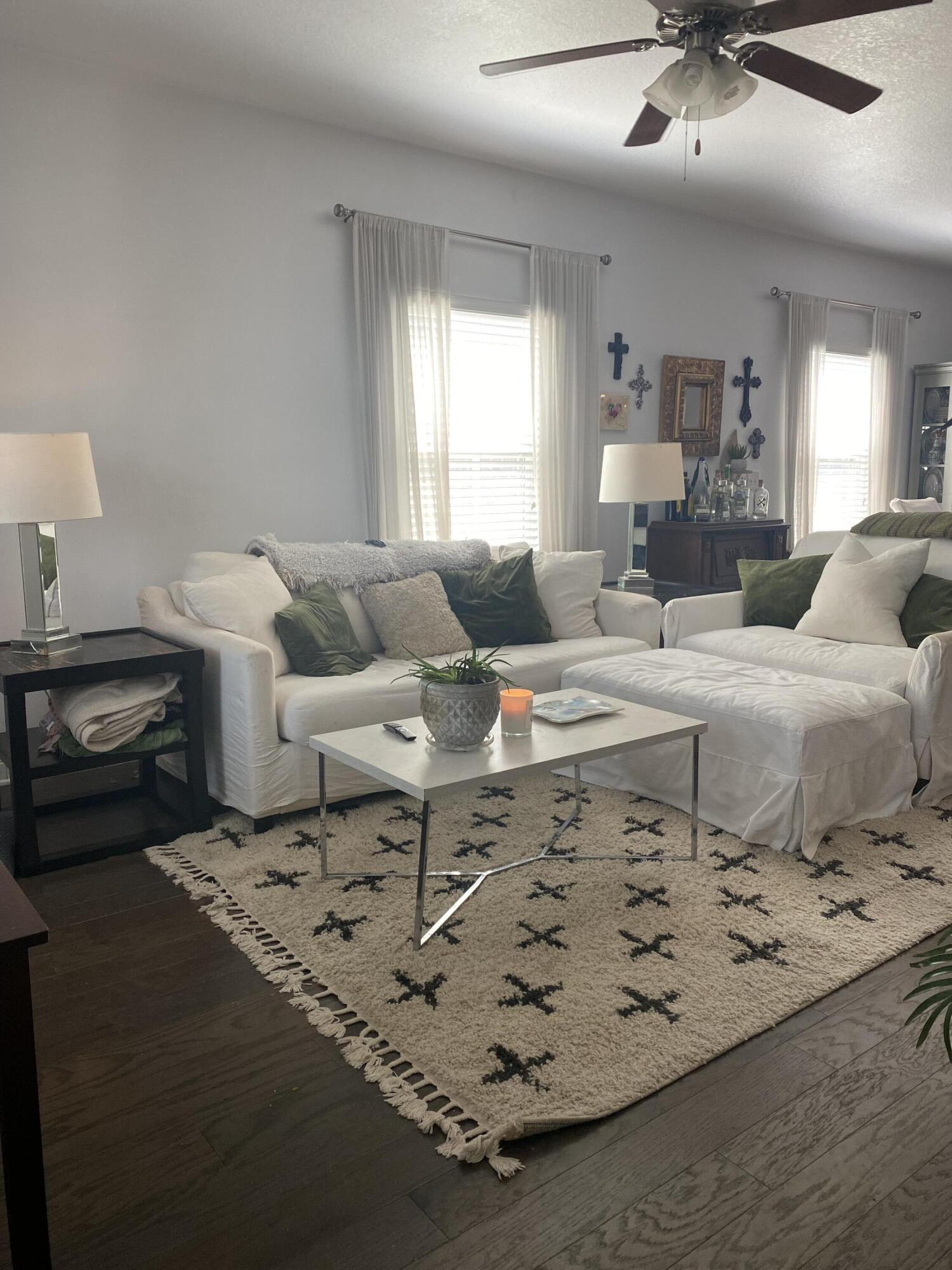 233 Maddox Street Santa Rosa Beach, FL 32459 - Photo 7 of 14 a living room with furniture and a chandelier
