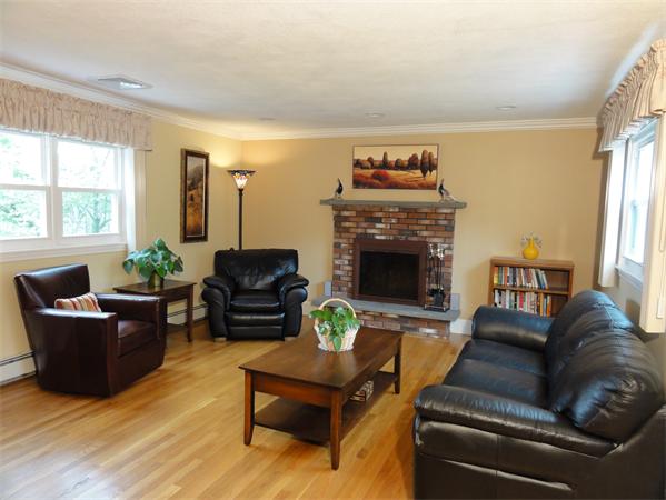156 Pleasant Street Lexington, MA 02421 - Photo 13 of 28 a living room with furniture and a fireplace