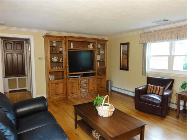 156 Pleasant Street Lexington, MA 02421 - Photo 14 of 28 a living room with furniture a flat screen tv and a window