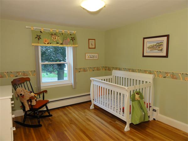 156 Pleasant Street Lexington, MA 02421 - Photo 16 of 28 a view of a bedroom with furniture and windows