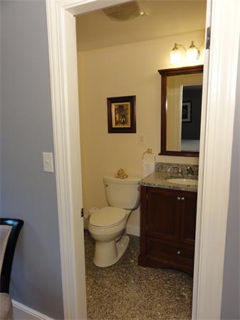 156 Pleasant Street Lexington, MA 02421 - Photo 19 of 28 a bathroom with a toilet sink and mirror