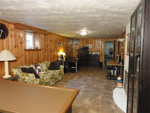 156 Pleasant Street Lexington, MA 02421 - Photo 22 of 28 a living room with stainless steel appliances furniture a rug and a kitchen view