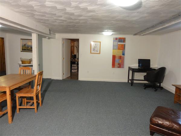 156 Pleasant Street Lexington, MA 02421 - Photo 23 of 28 a livingroom with workspace and a window