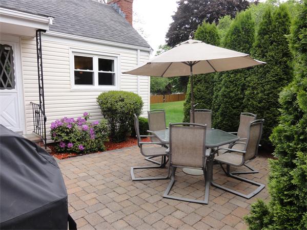156 Pleasant Street Lexington, MA 02421 - Photo 26 of 28 a view of a backyard with furniture and garden