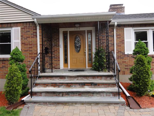 156 Pleasant Street Lexington, MA 02421 - Photo 28 of 28 a front view of a house with potted plants