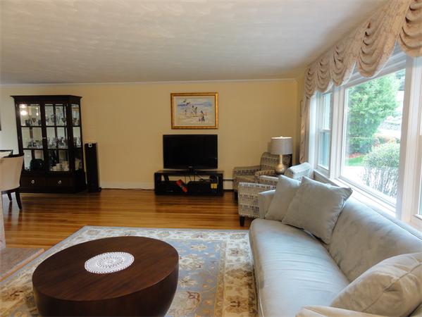 156 Pleasant Street Lexington, MA 02421 - Photo 5 of 28 a living room with furniture and a flat screen tv